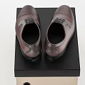 Brown Leather Formal Shoes Showcased on Black and Beige Storage Box