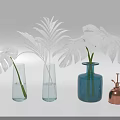 Transparent and Blue Glass Vases with Monstera and Palm Leaves on White Background
