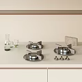 White Kitchen Countertop With Three Gas Stove Burners Knobs Water Bottle And Light Cabinets
