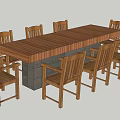 Long Rustic Wooden Dining Table With Surrounding Wooden Chairs And Stone Base
