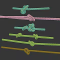 Various Rope Knots Displayed On Different Lengths Of Natural Fiber Ropes