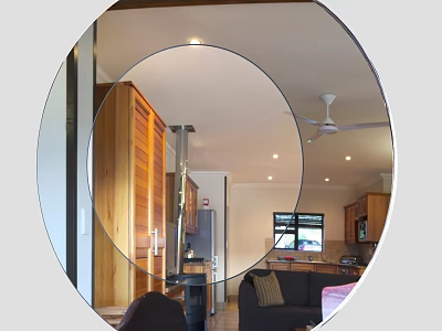 Round Mirror Reflecting Modern Interior With Wooden Cabinets Sofa And Ceiling Fan 3d model