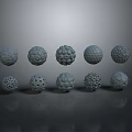 Ten Different Textured Spheres With Various Patterns On Gray Background With Reflections