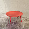 Red Round Stool With Three Legs On Marble Floor And Light Wall 3d model