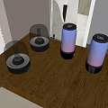 Multiple Desktop Speakers with Transparent Dome and Colorful Lights on Wooden Tabletop Near Window Artwork