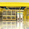 Indoor Playground Snack Area With Yellow Interior Glass Display Cabinets And Counter
