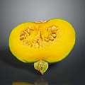 Fresh Sliced Pumpkin With Green Skin Showing Yellow Flesh And Seeds On Gray Surface