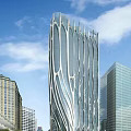 Modern Skyscraper With Unique Glass Facade Surrounded By Buildings Under Blue Sky
