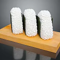 Three Sushi Rolls On Wooden Tray With Rice And Seaweed Wrap