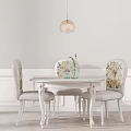 Elegant White Dining Table Set With Floral Chairs Hanging Lamp And Vase On Wainscoting Wall