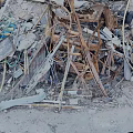 Pile of Construction Debris with Wooden Planks Metal Scrap and Rubble