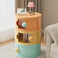 Wicker Side Table With Wheels Holding Books And Potted Plant Beside Sofa