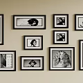 Stylish Photo Wall With Multiple Black And White Portrait Frames On Beige Wall