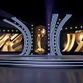 Elegant Modern Awards Stage With Golden Trophy Large Golden Screens And Curved Lights