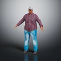 Man in Striped Shirt and Blue Jeans Standing Against Gray Background