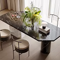 Elegant Modern Black Marble Dining Table Set With Chairs Green Plants And Stacked Books