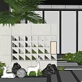 Gray Grid Garden Feature Wall With Green Plants White Deer Statues Stones And Illuminated Lamp