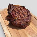 Perfectly Grilled Juicy Steak On Wooden Cutting Board With Charred Edges