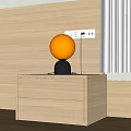 Modern Simple Table Lamp With Spherical White Shade And Black Base On Wooden Cabinet