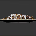 Loaded Fries Topped With White Sauce Red Seasoning And Beans On White Oval Plate