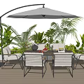 Outdoor Table and Chair Set with Cantilever Umbrella on Wooden Deck and Lush Green Plants