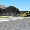 Modern Geometric Building Exterior With Metal Facade Glass Windows And Lawn Square Front Plaza