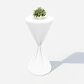 White Tapered Table With Round Top And Green Potted Plant Decoration