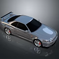 Silver Sports Car with Rear Spoiler Black Windows Red Brake Calipers and Sporty Exterior Design