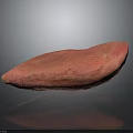 Pink Sweet Potato With Textured Surface Displayed On Black Background And Reflection