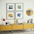 Yellow TV Stand with Red Desk Lamp Books and Four Framed Wall Artworks