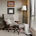 Comfortable Lounge Chair With Patterned Gray Cushions Wooden Armrests Floor Lamp And Window Blinds