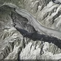 Alpine Mountain Terrain Featuring Snow Capped Peaks Glaciers And Rocky Ridges