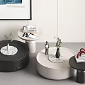 Modern Round Black And White Coffee Tables With Marble Top And Decorative Plants Books