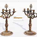 Vintage Ornate Metal Candelabra With Decorative Carvings And Multiple Candle Holders