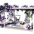 Pergola Decorated with Purple Flowers and Hammock Where Person Sits on Stone Floor