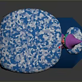 Blue Cushion Featuring White Geometric Pattern And Small Doll With Pink Hat