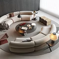 Modern Curved Beige Sofa And Round Coffee Table With Books Fruit Platter And Floor Lamp