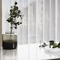 Dark Vase With Eucalyptus Leaves On White Marble Countertop By Sheer Curtains And Natural Light