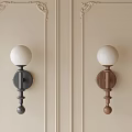 White Globe Shade Wall Lamps With Black And Wooden Bases On Decorative Walls