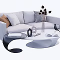 Gray Sofa and White Oval Coffee Table Set with Decorative Pillows Dried Flowers and Open Book