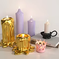 Golden Purple And White Candle Lamps With Melted Design And Pink Holder On Books