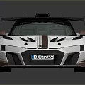 Racing Style Sports Car With Black Roof Large Rear Spoiler And Bronze Wheels