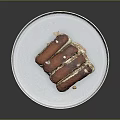 Delicious Layered Dessert On White Plate With Brown Topping And Cream Base