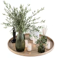 Dark Green Striped Vase with Green Foliage on Wooden Tray and White Candles Small Diffuser
