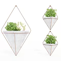 Geometric Hanging Planters With Green Plants Metal Frame And White Pot