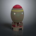 Artillery Weapon With Green Body Red Top Yellow Stripes Circular Holes and Red Base