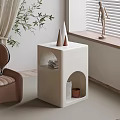 Modern Minimalist White Side Table With Circular Cutouts Decorative Cones Books And Small Potted Plant