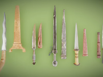 Various Decorative Knives with Diverse Blades and Handles on Green Background 3d model