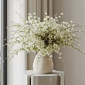 Fresh White Flowers In Ceramic Vase On Window Side Table With Minimalist Decor