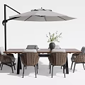 Outdoor Wooden Table And Wicker Chair Set With Umbrella Vase And Green Plant